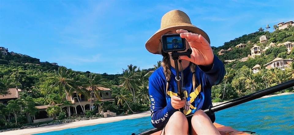 Jan paddleboarding with a camera
