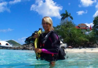Jan in scuba gear in shallow water